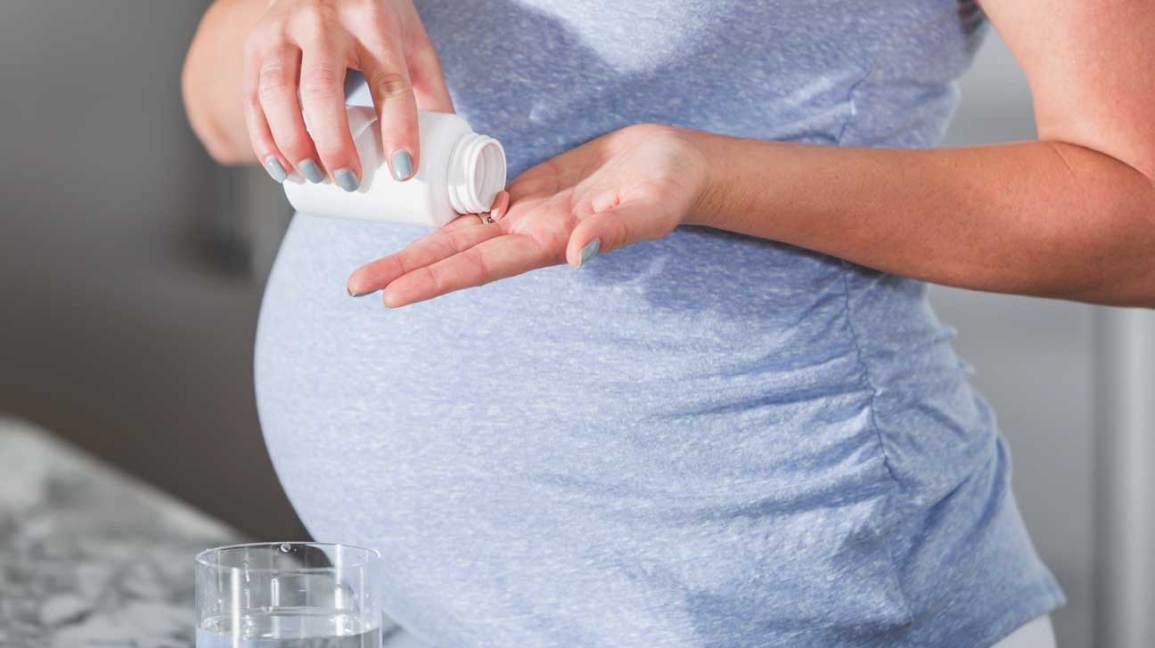 Image result for pregnant woman taking supplements